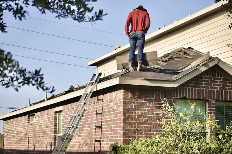 Professional roofer working on a residential roof in Fox Hills North